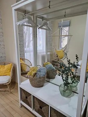 a room with a mirror and baskets on a table at S íRMA Apartment - The Soul of Central Sofia in Sofia