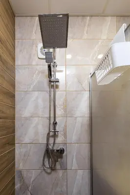 a shower in a bathroom with a glass door at Bright Modern 2BD Apartment with Panoramic View by Flat Mаnager in Plovdiv