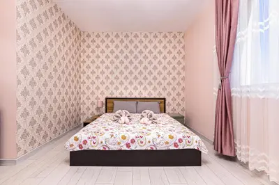 a bedroom with a bed with two pink bows at Bright Modern 2BD Apartment with Panoramic View by Flat Mаnager in Plovdiv