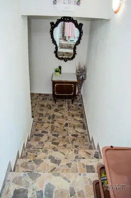 a hallway with a tile floor and a mirror at Къща за гости Рупите , Guest House Relax Rupite in Rupite