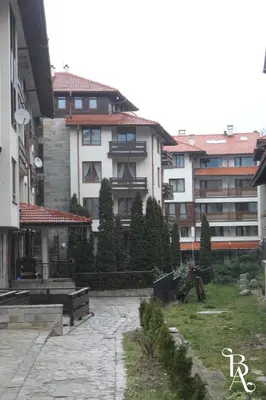 a group of buildings in a city with trees at Bansko Apart in Bansko