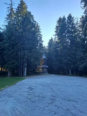 a large parking lot with a gazebo in the trees at Family Studio 302, Villa park in Borovets