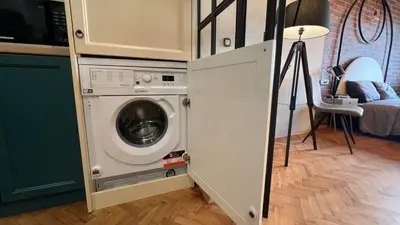 a washer and dryer in a kitchen next to a room at Heart of the City Center Lux Apartment with View in Sofia