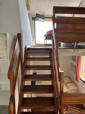 a staircase leading up to a bunk bed in a tiny house at Александрова вила 1 in Zlatograd
