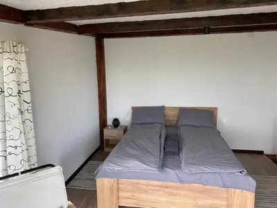 a bedroom with a bed in a room at Александрова вила 1 in Zlatograd