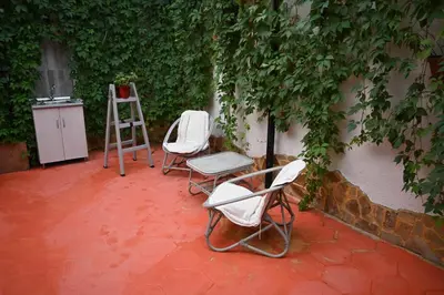 two chairs and a ladder sitting on a patio at Villa Magicland in Sofia