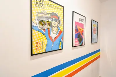 a group of framed art on a wall at 3 Rooms Together Budget Central Stay in Sofia