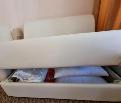 a white drawer in a closet with two pillows at Borovets Ski&Spa Studio - Semiramida Garden A16 in Borovets