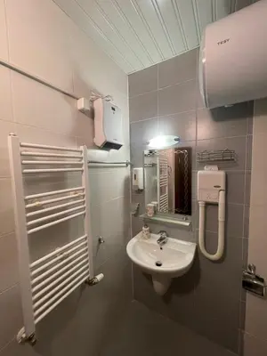a small bathroom with a sink and a mirror at Apartment in Belvedere Club G205 in Bansko