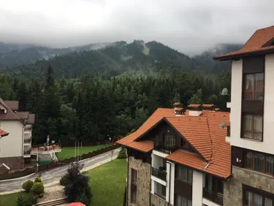 a view of a mountain with trees and buildings at Borovets Hills Apartments - Studio 33 in Borovets
