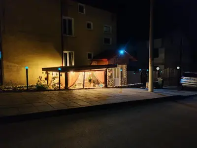 a building with lights on it at night at Делоре in Sarnitsa
