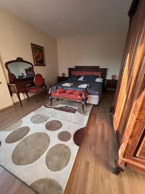 a bedroom with a bed and a large rug at Dalv Residence - SPA Fairy Tale in old Sofia in Sofia