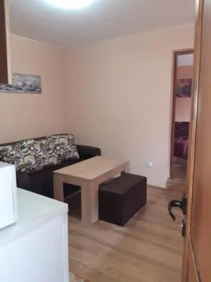 a living room with a couch and a table at Райчевата къща - Кюстендил in Kyustendil