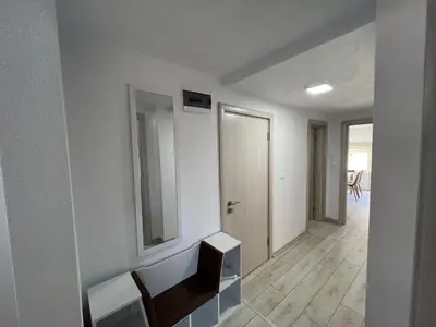 a white room with a sink and a mirror at Апартамент Панорама Рози in Sandanski