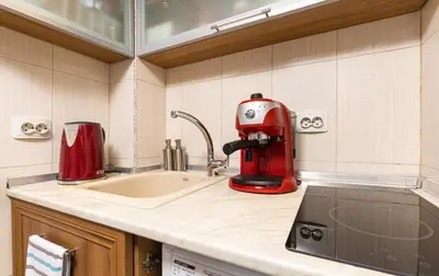 a kitchen with a mixer and a sink at Peaceful Riverside Studio with private Garden Center Parking in Plovdiv