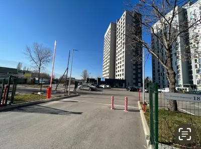 an empty street in a city with tall buildings at Mountain View Apartment 1 + Parking in Sofia