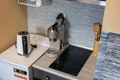 a kitchen counter with a microscope on top of it at Vitosha View Apartment with Parking in Sofia
