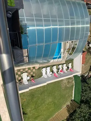 an overhead view of a water tank with pink shoes at ENIS Hotel със закрит и отоплен минерален басейн in Sapareva Banya