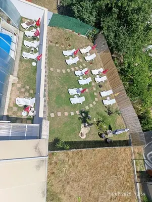 an overhead view of a group of people in a yard at ENIS Hotel със закрит и отоплен минерален басейн in Sapareva Banya