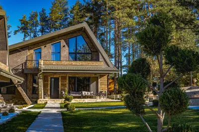 a home with a stone house at Вила АМРИТА in Tsigov Chark