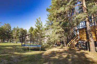 a playground in a park with a swing at Вила АМРИТА in Tsigov Chark