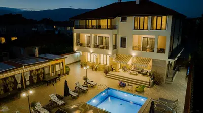 an aerial view of a house with a swimming pool at Слънчевите Къщи in Banya