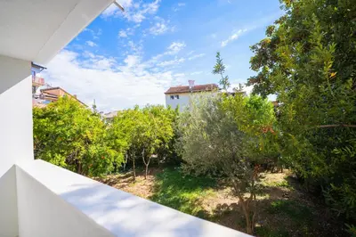 a view of a garden from the balcony of a house at The moon in Sandanski