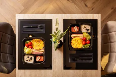 two trays of food sitting on top of a table at -- ESTE PARK HOTEL -- part of Urban Chic Luxury Design Hotels - Parking & Compliments - next to Shopping & Dining Mall Plovdiv in Plovdiv