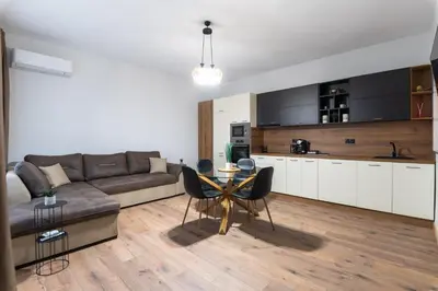 a living room with a couch and a table at La Luna - High-end 2BD Flat in the TOP centre by Flat Mаnager in Sofia