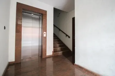 an empty hallway with a glass door and stairs at Trendy & Deluxe Apartment by Flat Mаnager in Plovdiv