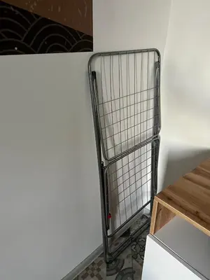 a shopping cart in a kitchen next to a wall at The rainbow 5 in Sofia
