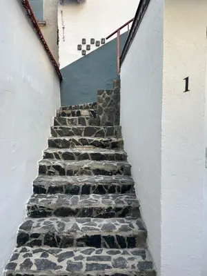 a stairway with stone steps in a building at The rainbow 5 in Sofia