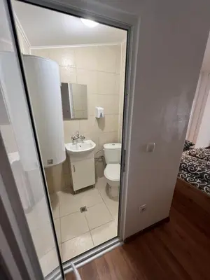 a bathroom with a toilet and a sink at The rainbow 5 in Sofia