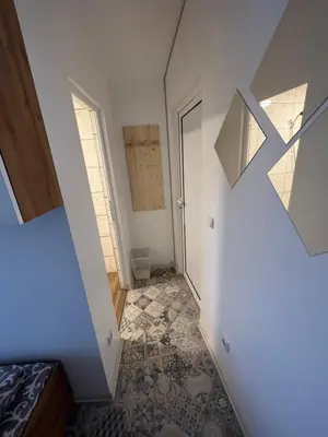 an attic room with a staircase and a door at The rainbow 6 in Sofia
