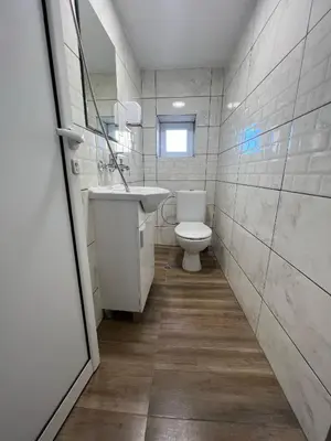 a bathroom with a toilet and a sink at The rainbow 7 in Sofia