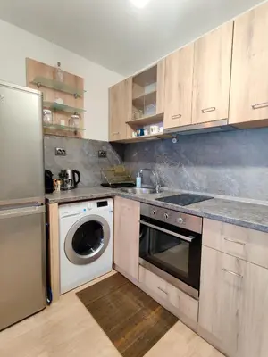 a kitchen with a washing machine and a dishwasher at Cozy Studio near the Historical Heart of Sofia by Flat Mаnager in Sofia