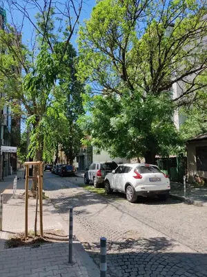 a street with cars parked on the side of the road at Cozy Studio near the Historical Heart of Sofia by Flat Mаnager in Sofia