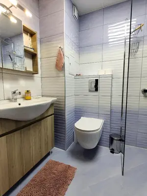 a bathroom with a toilet and a sink and a shower at Cozy Studio near the Historical Heart of Sofia by Flat Mаnager in Sofia