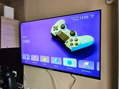 a video game controller sitting on top of a tv at Penthouse at Dream Bansko in Bansko