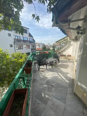 a group of benches on a balcony of a building at Central Studio with Lovely Terrace & Free street Parking in Plovdiv
