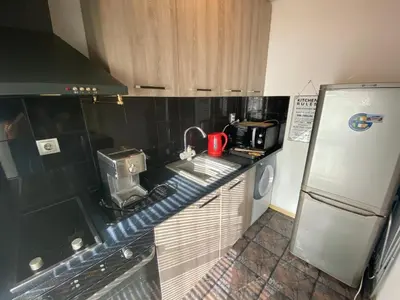 a small kitchen with a sink and a refrigerator at Central Studio with Lovely Terrace & Free street Parking in Plovdiv