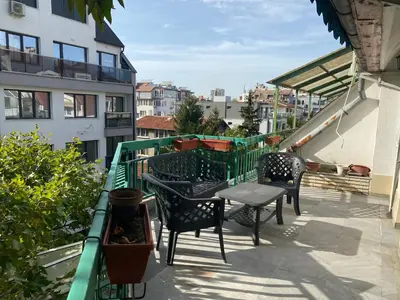 a patio with chairs and a table on a balcony at Central Studio with Lovely Terrace & Free street Parking in Plovdiv