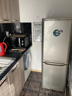 a kitchen with a refrigerator and a microwave at Central Studio with Lovely Terrace & Free street Parking in Plovdiv