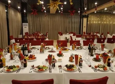 a long table with plates of food on it at Everest Hotel in Etropole