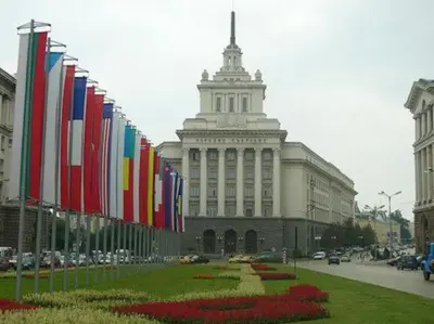 a row of flags in front of a building at Top Center Studio 3 in Sofia