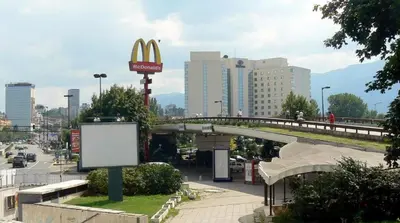 a view of a city with a mcdonalds sign and a bridge at Top Center Apartment 4 in Sofia