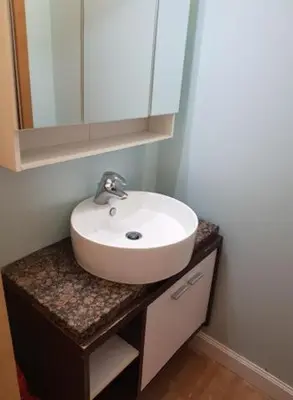 a bathroom with a white sink and a mirror at Top Center Apartment 4 in Sofia
