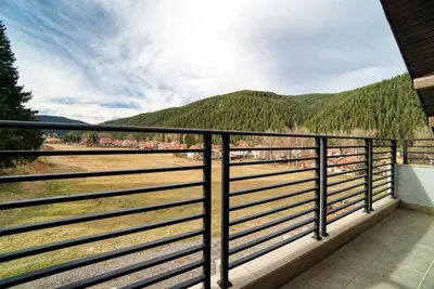 a balcony with a view of the mountains at MOUNTAIN HILL LUXURY VILLA in Madzhare