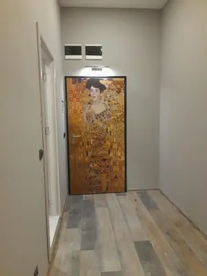 a painting of a woman on a wall in a room at Art Magus Hotel in Sofia