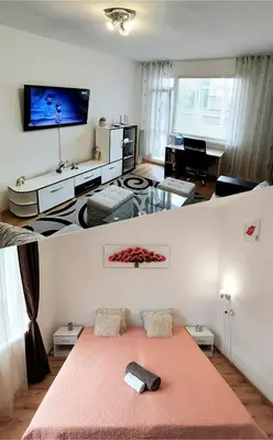 a living room with a bed and a tv at 3 Rooms Apartment, Top Center, 1st Floor Flat, AUBG, WiFi, PC i5 SSD, Tablet, AndroidMiTvBox, 3 LED TVs 200 Channels, Long Terrace, Self-Easy-Late Check-in, Stay Before Greece in Blagoevgrad